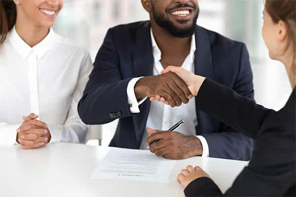 Image of happy mixed ethnicity couple handshaking Michelle