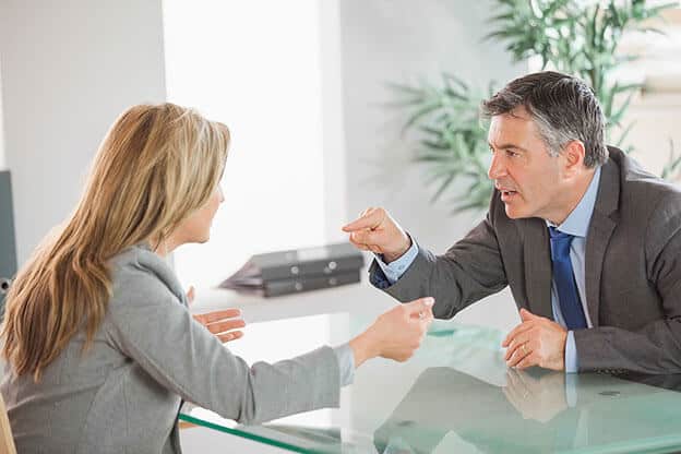 Image of a man and woman arguing in a business dispute